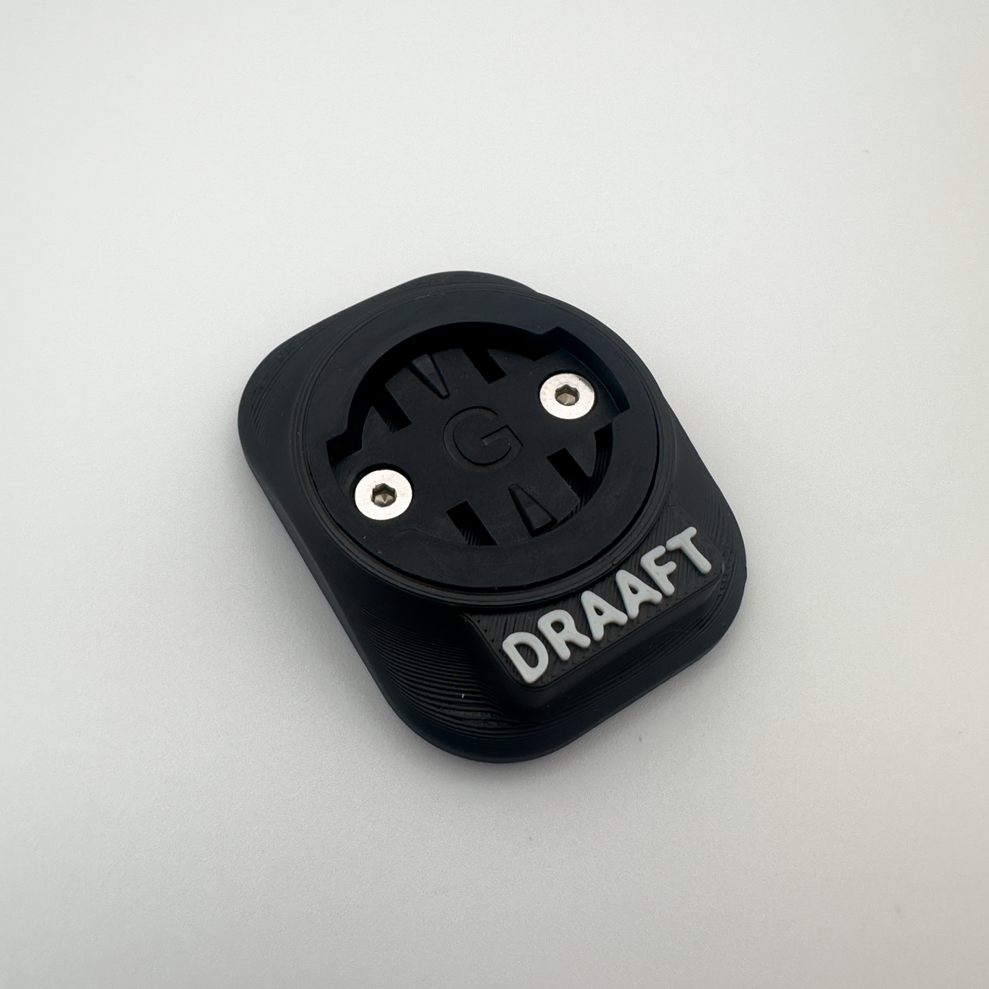 Black device with 'DRAAFT' branding on a light gray background