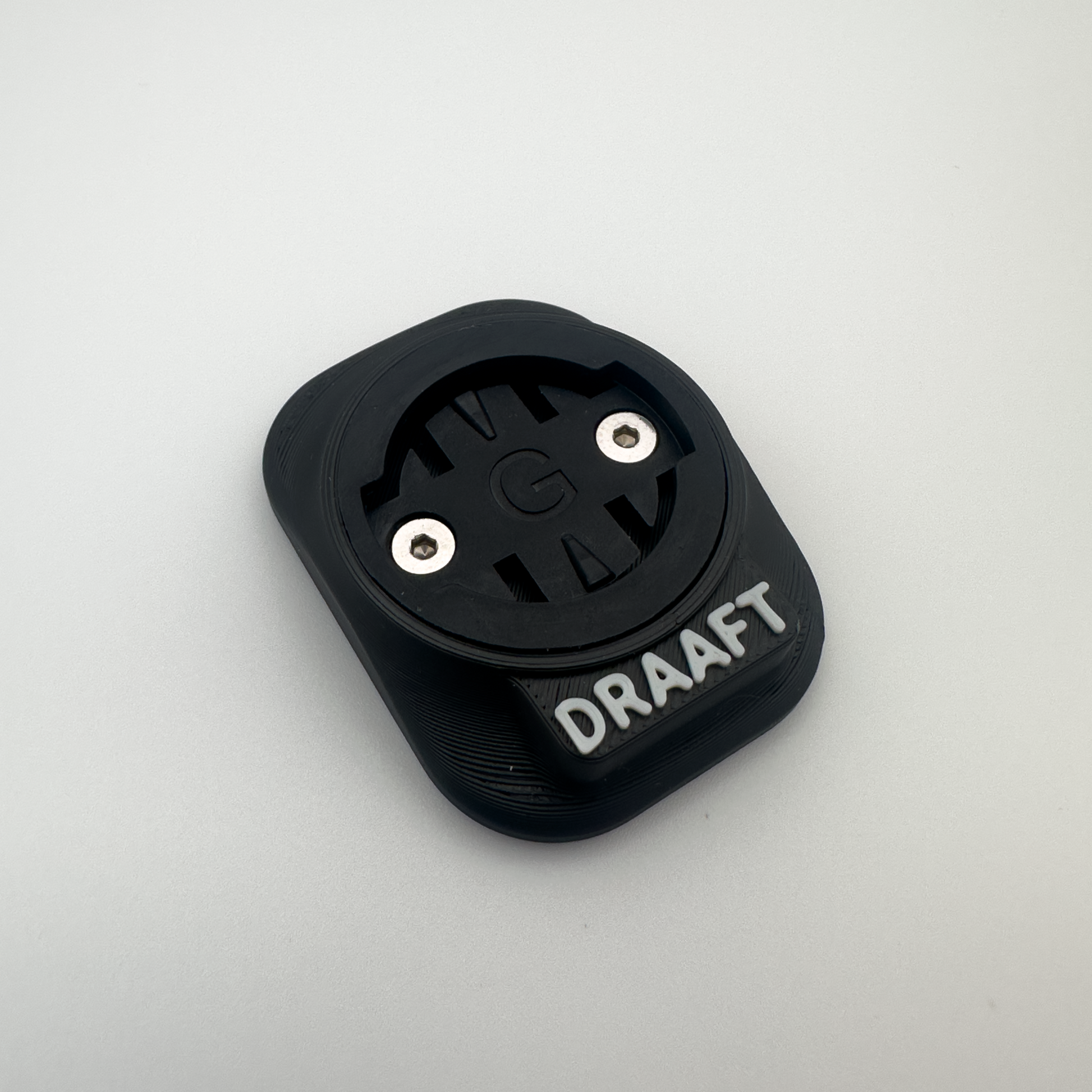 Black device with 'DRAAFT' branding on a light gray background